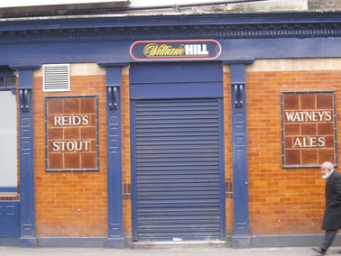 Reid's Stouts and Watneys Ales tiling on closed down South London pub