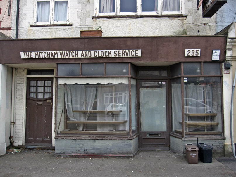 THE DECAYING PREMISES OF THE MITCHAM WATCH AND CLOCK SERVICE - STREATHAM VALE SW16